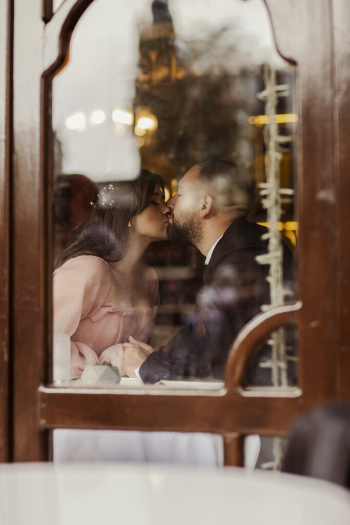 Couple wearing elegant outfits for a photoshoot in Istanbul inside a café near Istiklal Street
