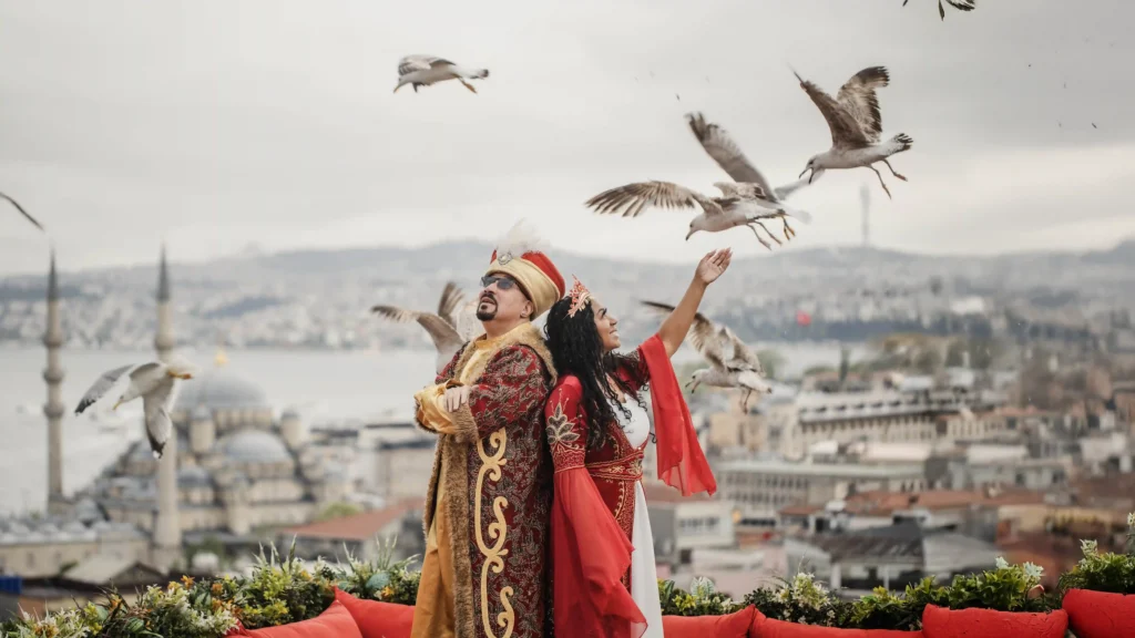 Ottoman costume rooftop photoshoot in Istanbul with seagulls and panoramic skyline