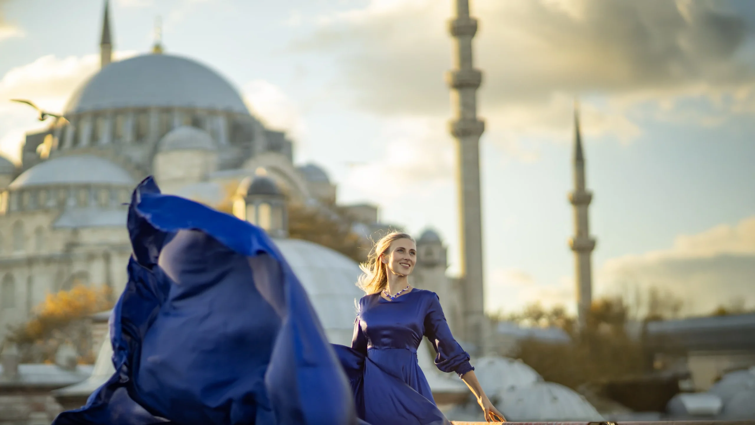 Flying dress photoshoot in Istanbul with Blue Mosque view and flowing blue dress