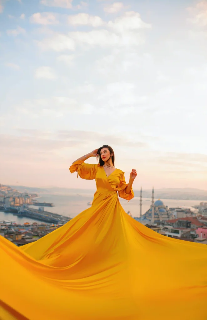 Flying dress rooftop photoshoot in Istanbul with panoramic city skyline