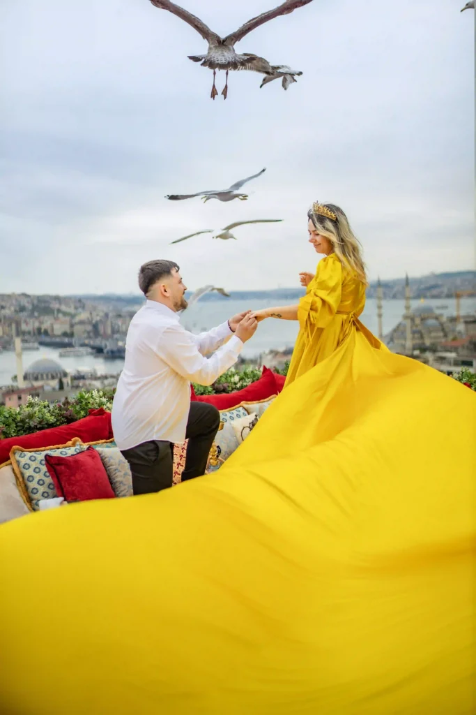 Flying dress surprise proposal on a private rooftop in Istanbul with panoramic city views.